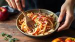 Mixing Apple Slaw with Tangy Dressing